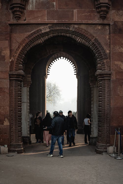 People in Gate of Qutb Minar in Delhi, India