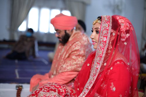 Free Bride in a Pink Sari and Veil During the Ceremony Stock Photo