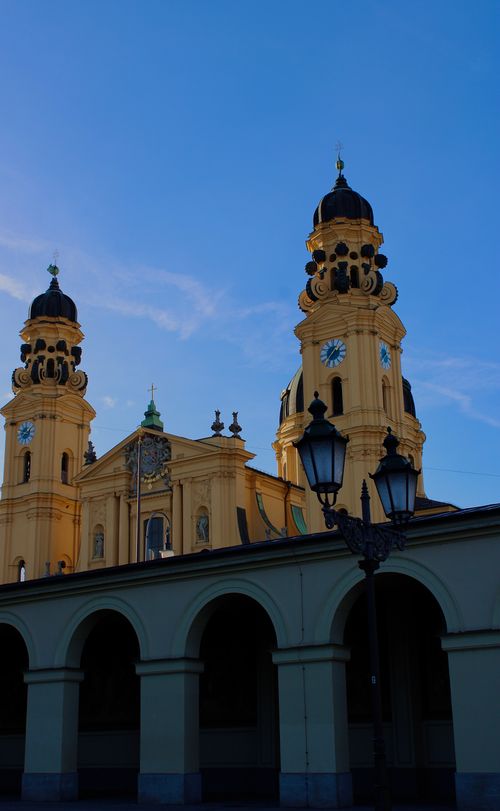 Free Capture of the Theatine Church showcasing its Baroque architecture under a clear blue sky. Stock Photo