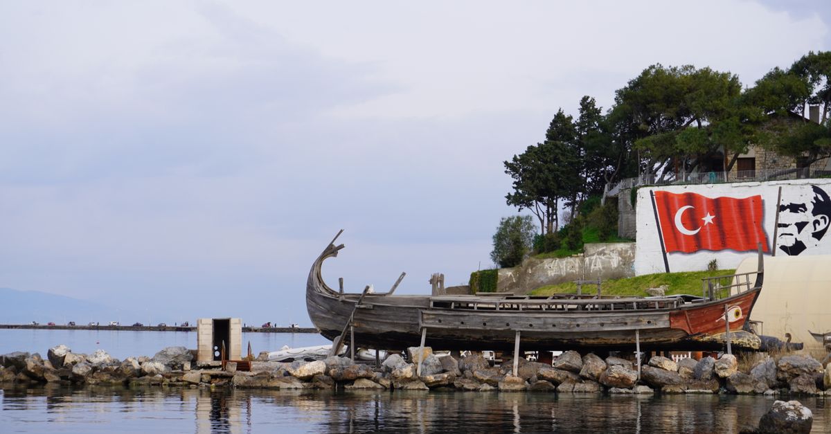 Wooden Boat on Rocks on Sea Shore · Free Stock Photo