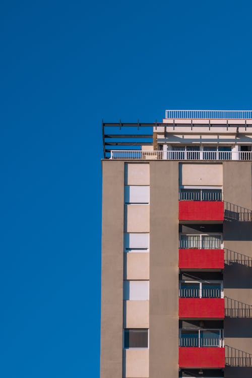 Free View of an Apartment Building in City under Blue Sky  Stock Photo