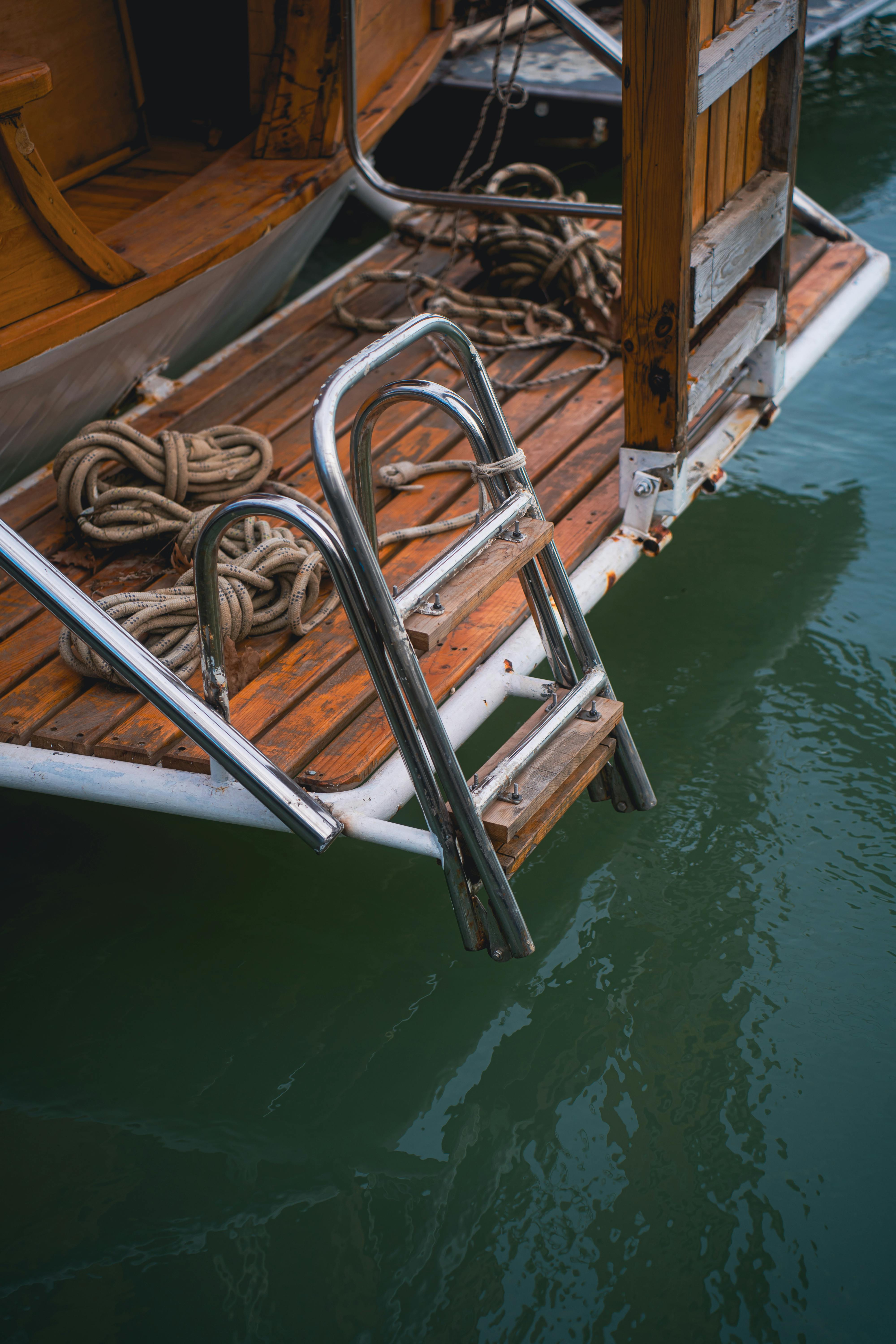 ladder and ropes on wooden vessel