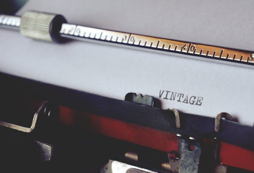 Close-up shot of a vintage typewriter typing the word 'VINTAGE'. Perfect for retro and writing themes.