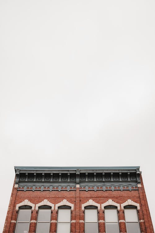 Low Angle Shot of an Old Brick Building in City 