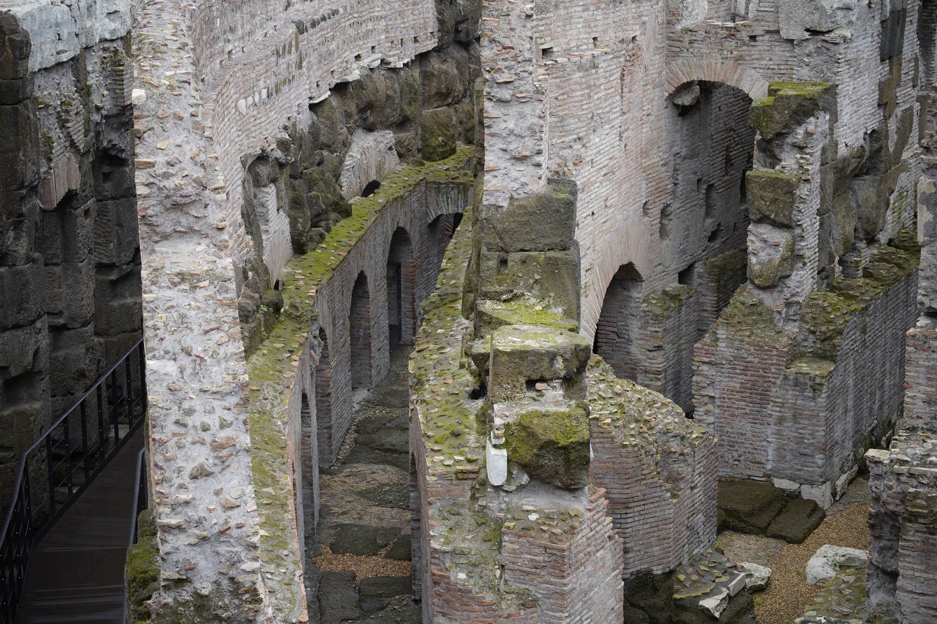 Exposed underground chambers inside the Colosseum in Rome, reached only with top-tier Colosseum tickets