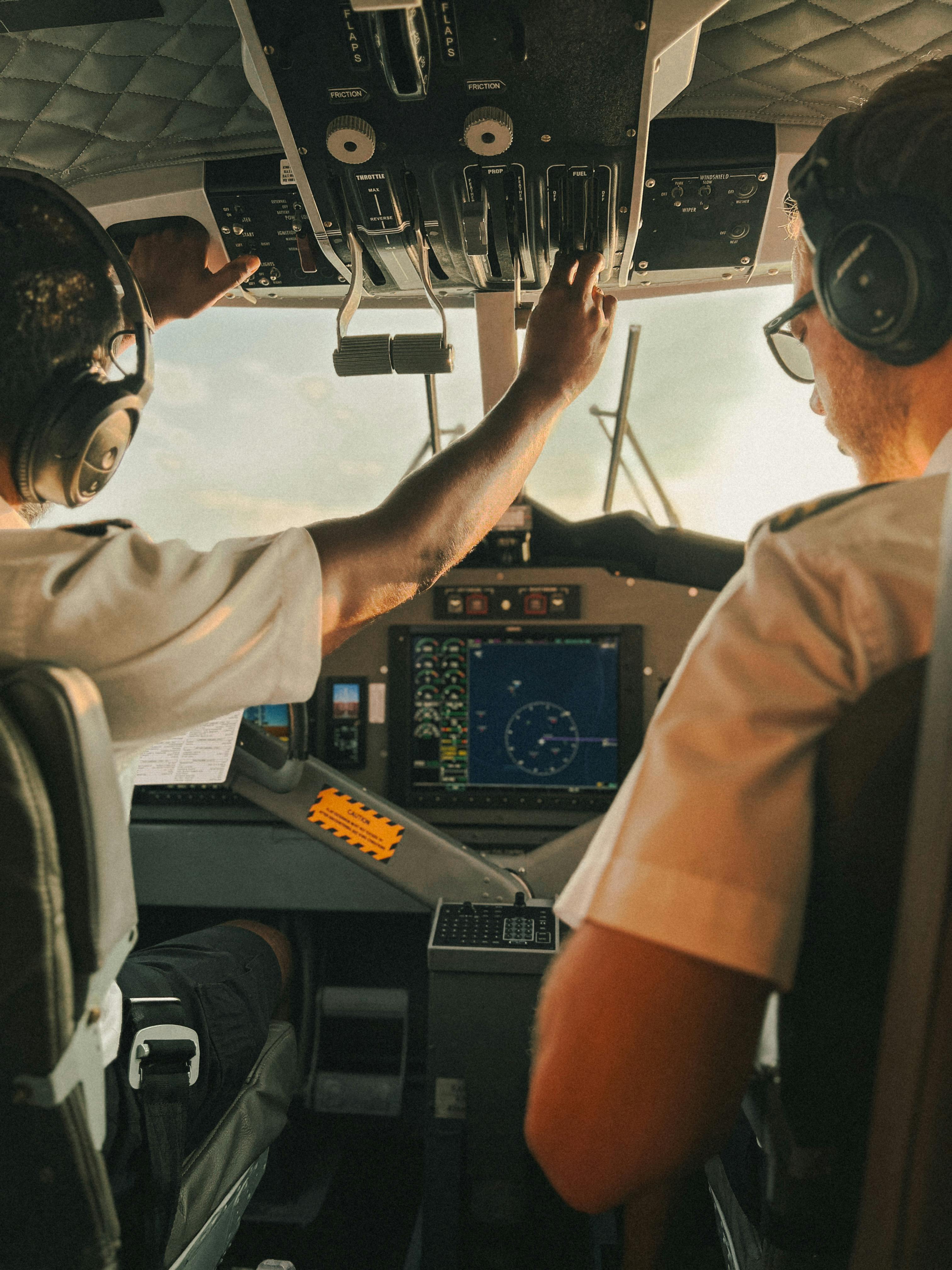 Persons On Aircraft Pointing On View During Daytime · Free Stock Photo