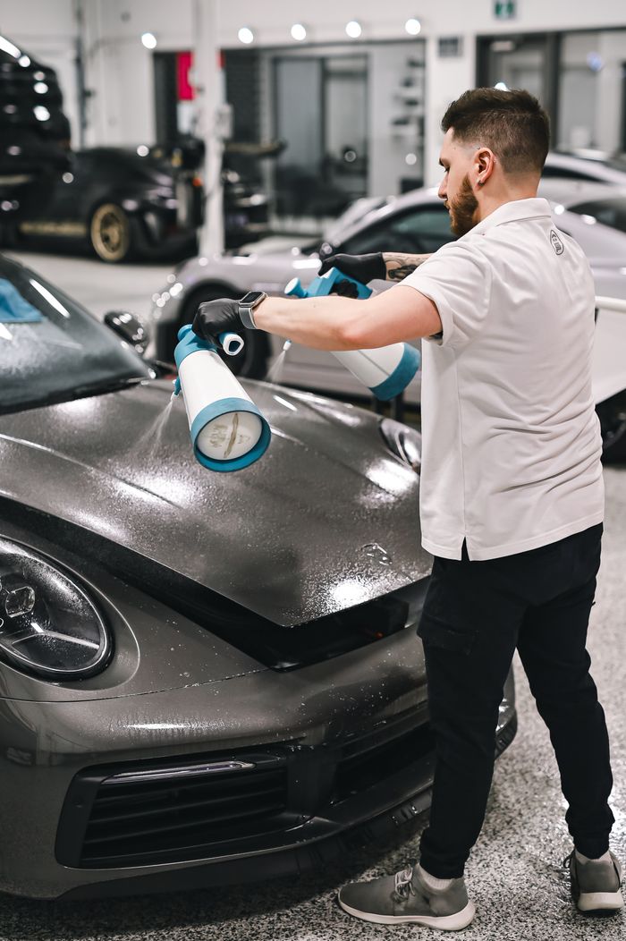 Applying protection to a sports car hood