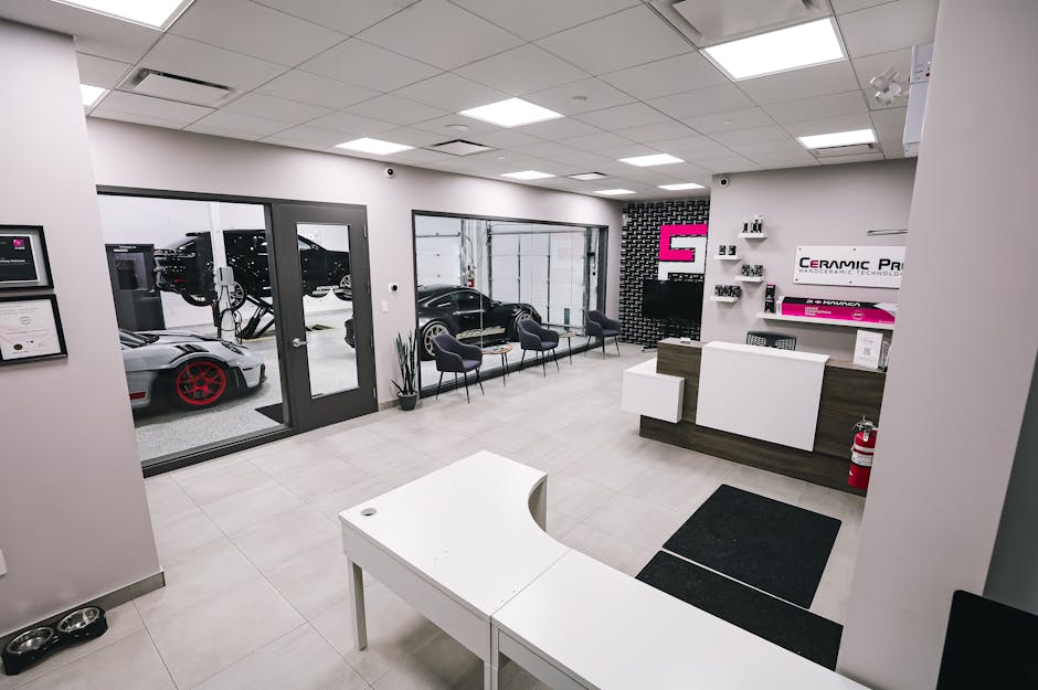 Friendly independent shop reception area with luxury cars in service - bmw and mercedes repair