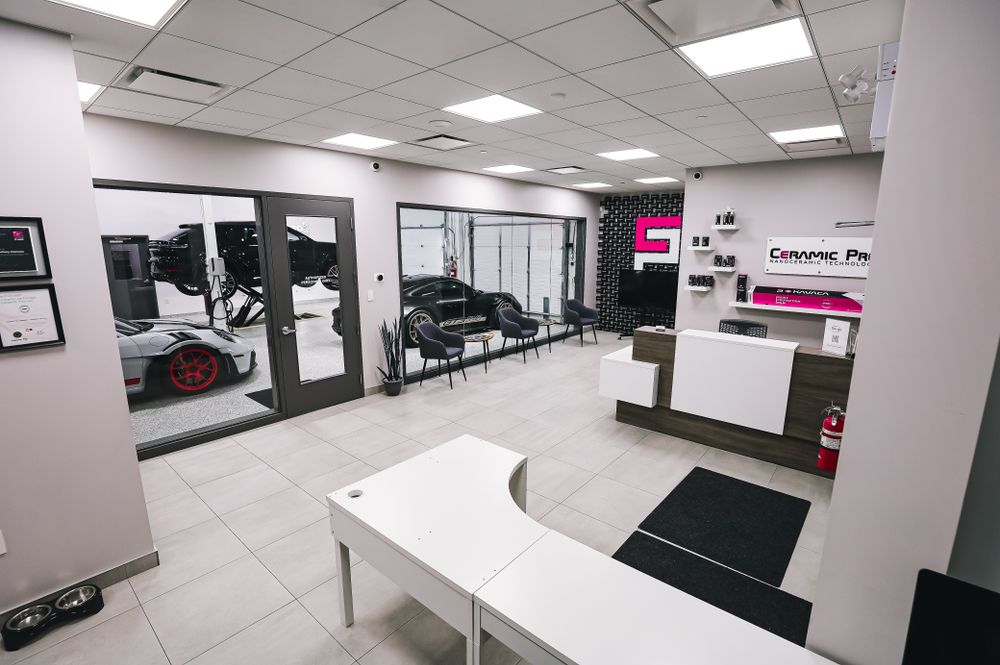 Spacious and modern car salon with luxury cars in a pristine interior setting