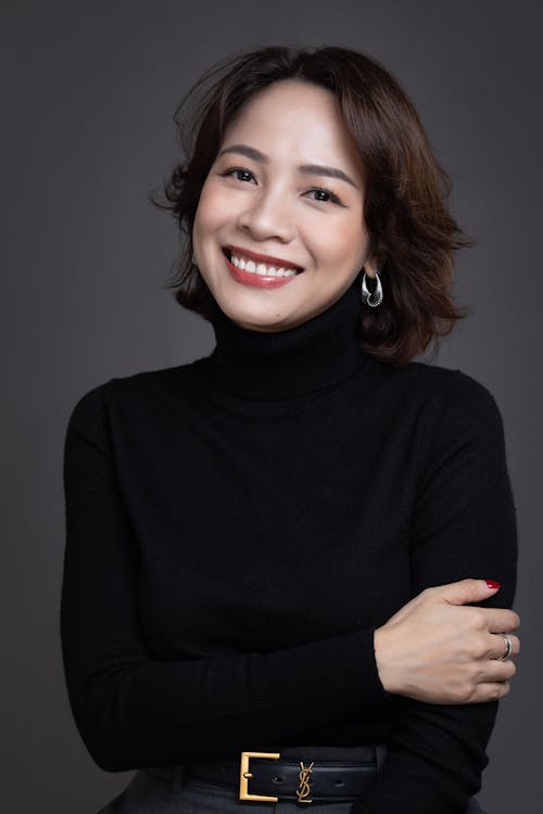 A Smiling Woman in a Black Sweater