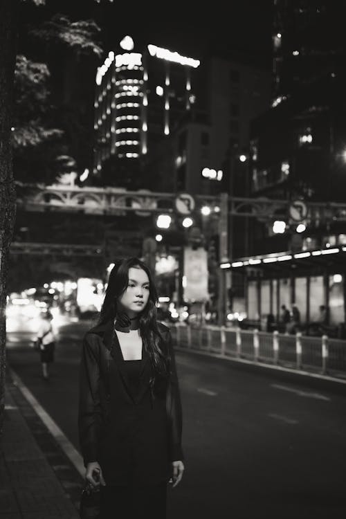 Woman on Street at Night in Black and White