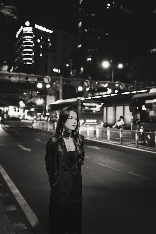 Woman Standing on Street in Black and White