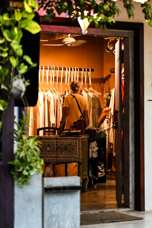 Warmly lit boutique entrance seen from the street — photo by Sachu Zayn on Pexels