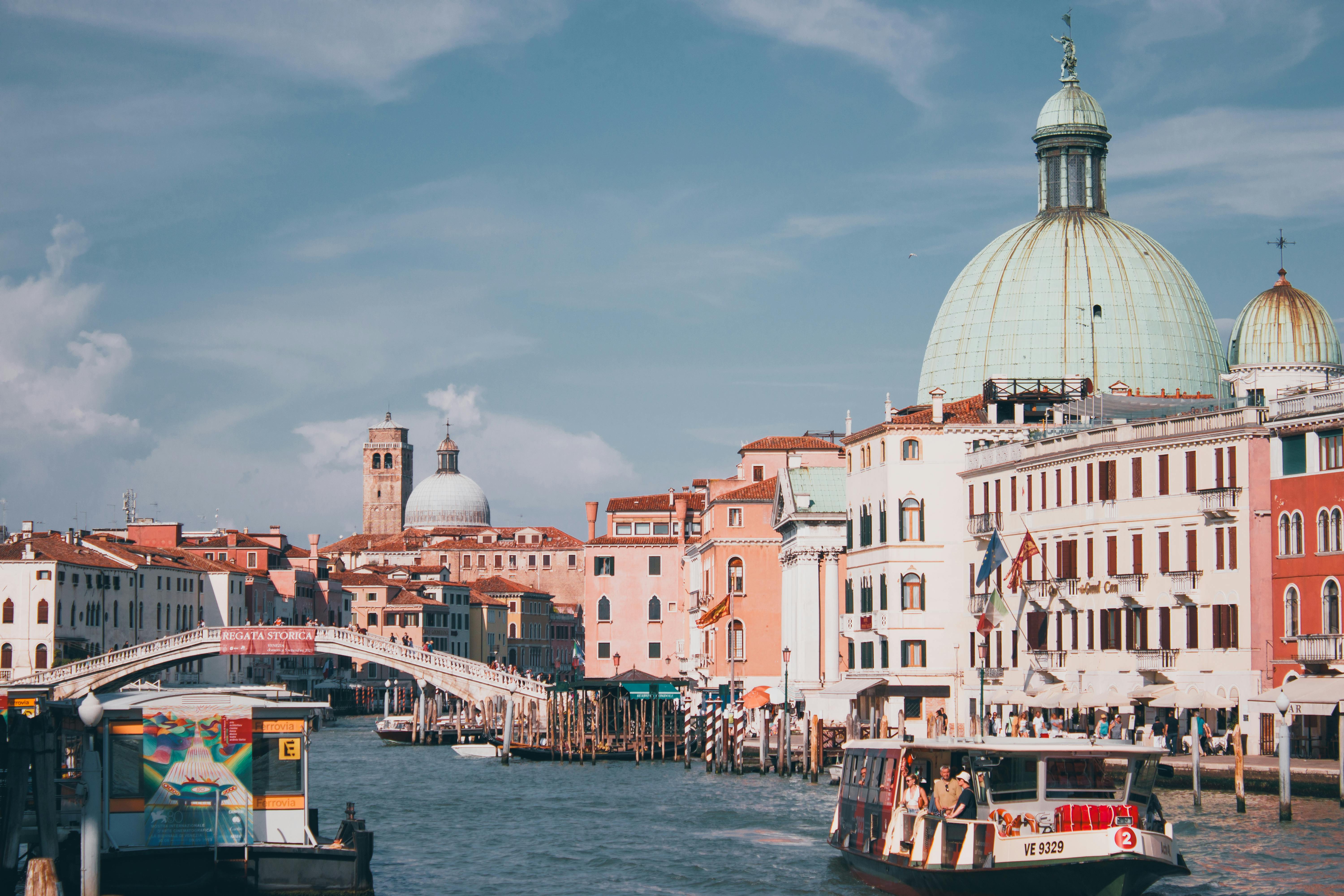 Free Explore the stunning architecture and waterways of Venice with vibrant domes overlooking the Grand Canal. Stock Photo