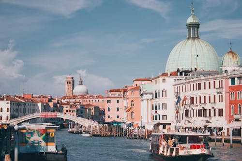 Free Explore the stunning architecture and waterways of Venice with vibrant domes overlooking the Grand Canal. Stock Photo