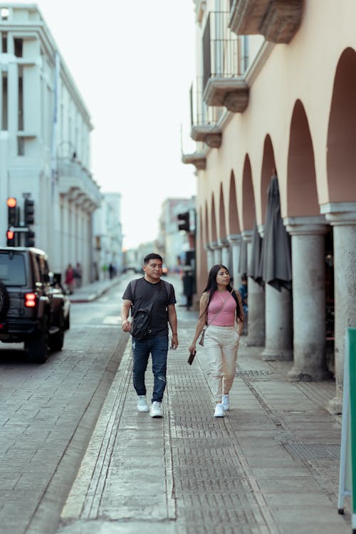 Couple on Sidewalk along Colonnade
