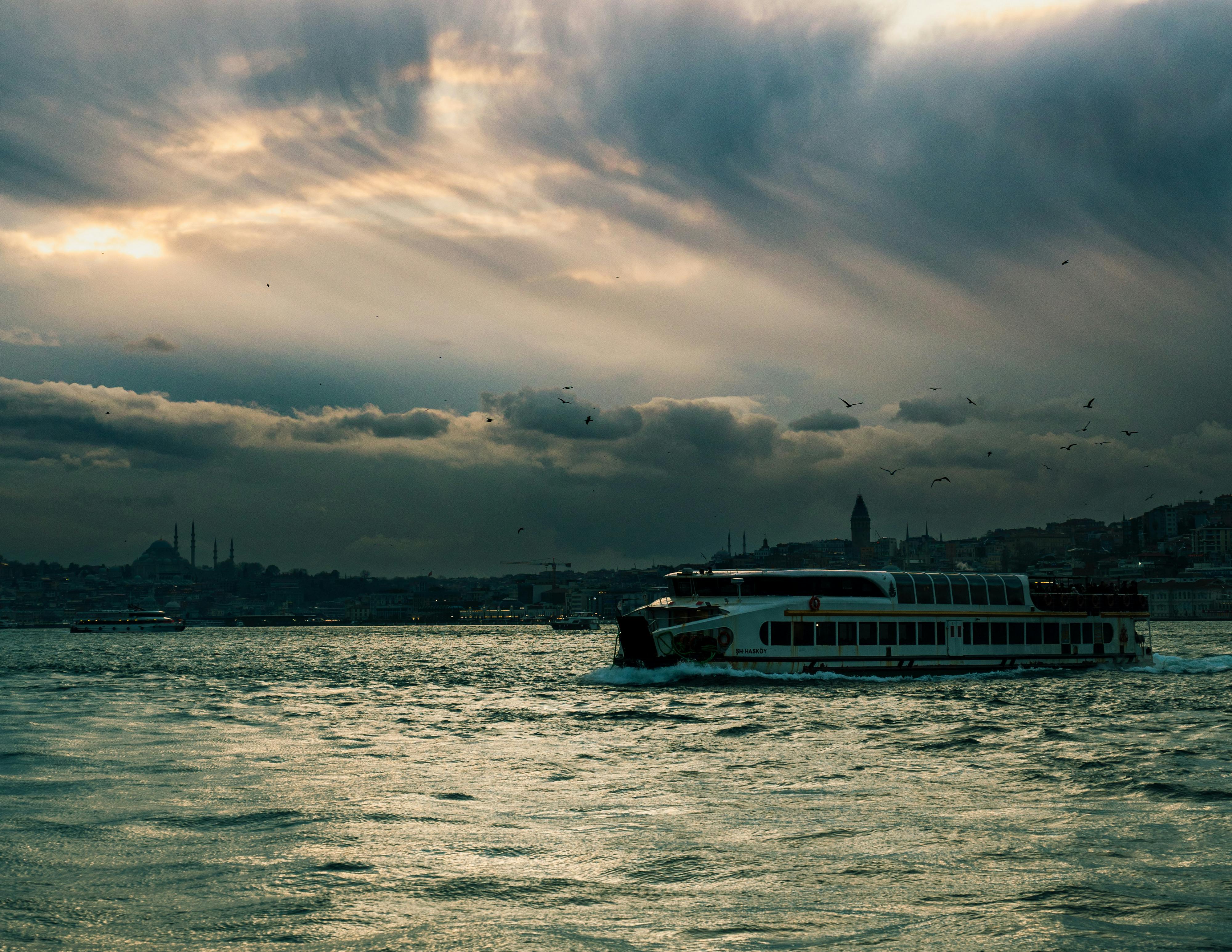 ferry sailing on bosporus at dusk