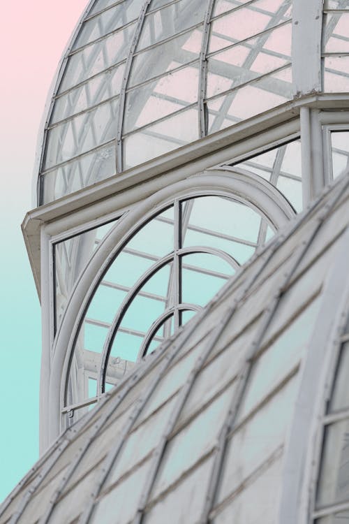 A close up of a glass dome with a blue sky