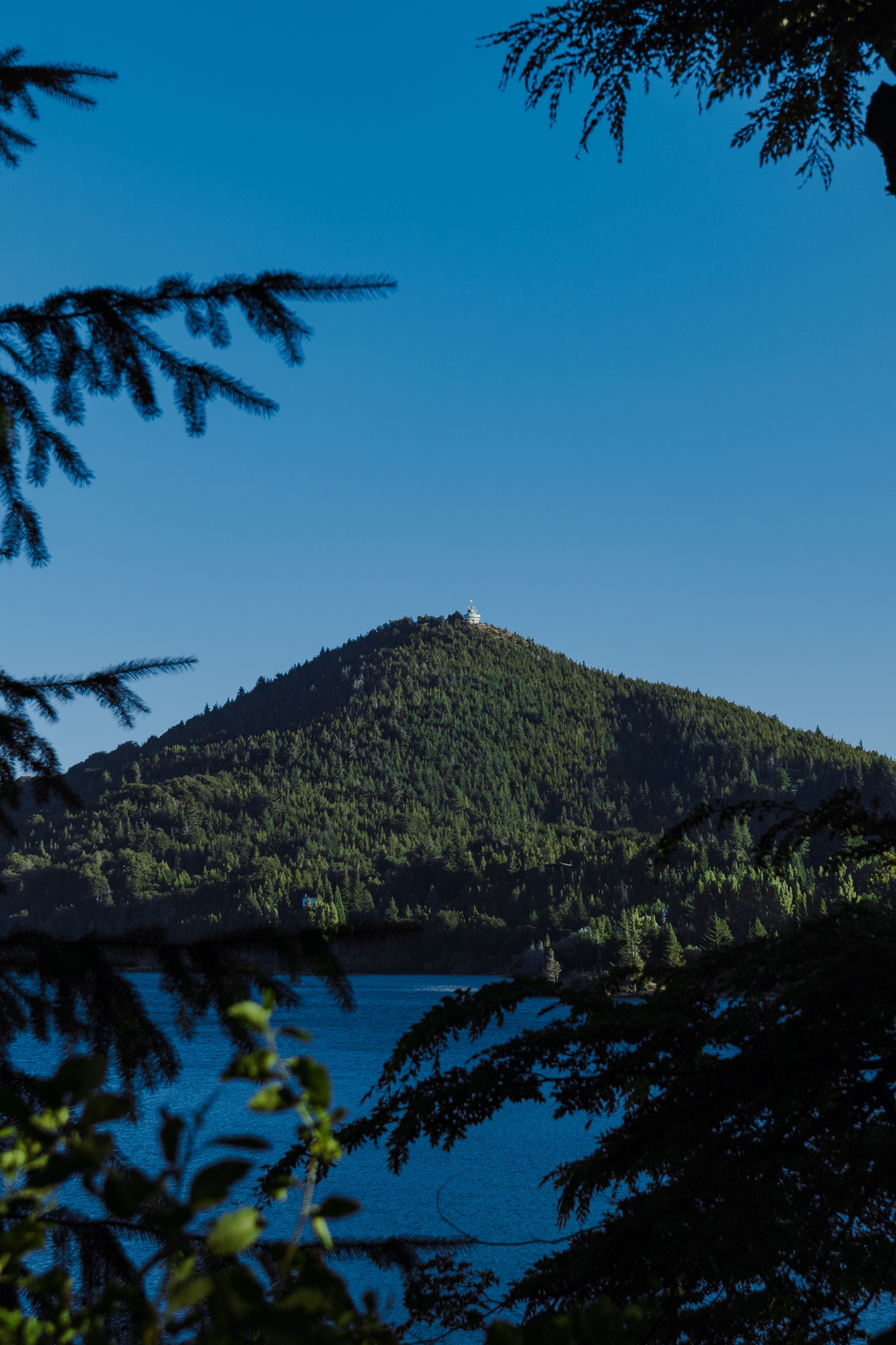 View of a Green Hill under a Clear, Blue Sky · Free Stock Photo