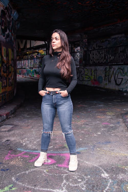 Woman in Tied Rag Jeans and Black Turtleneck Sweater