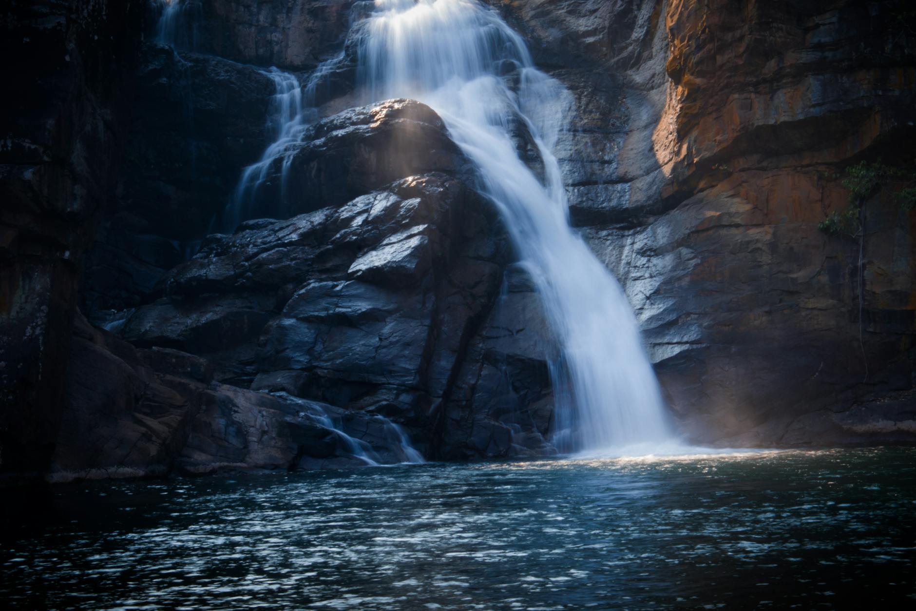 Captivating view of cascading waterfalls flowing over rocky cliffs in Odisha, India.