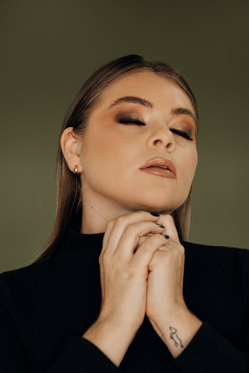 Portrait of a Young Woman Wearing a Glamour Makeup Look 