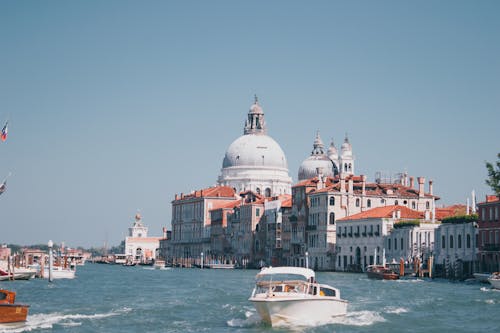 View of Boats on the Grand Canal and the Santa Maria della Salute Church in Venice, Italy