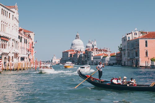 View of Boats on the Grand Canal between Buildings and the Santa Maria della Salute Church 