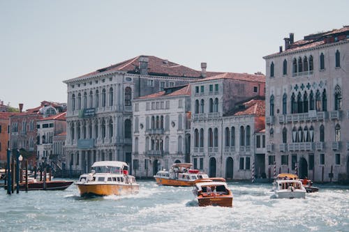 View of Boats on the Grand Canal and Waterfront Buildings in Venice, Italy 