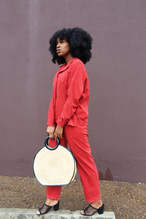 Woman Holding White Handbag