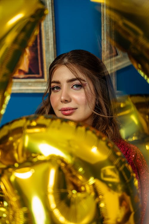 Free Woman with Golden Birthday Balloons  Stock Photo