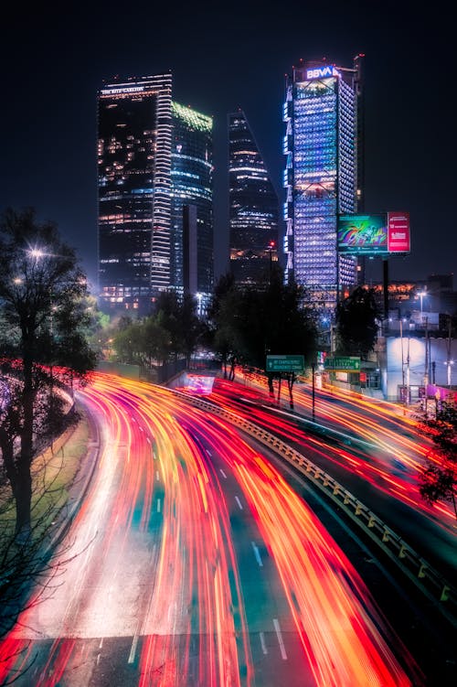 Red Light over Street in City with Skyscrapers behind at Night