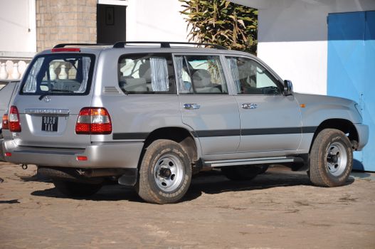 Silver SUV parked outside a building in Antananarivo, Madagascar.