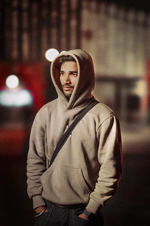 Man with Hood on Standing at Night