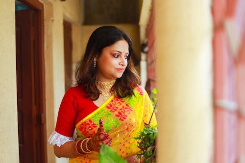 Photo of a Young Woman Wearing a Colorful Sari 