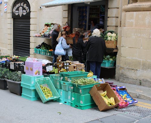 Customers Buying Food on a Street 