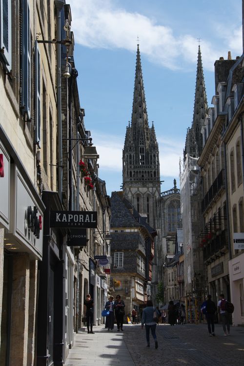 Free View of Saint Corentin Cathedral amidst the urban streets of Quimper, France. Stock Photo