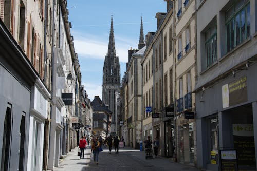 Saint Corentin Cathedral Tower behind Street in Quimper in France