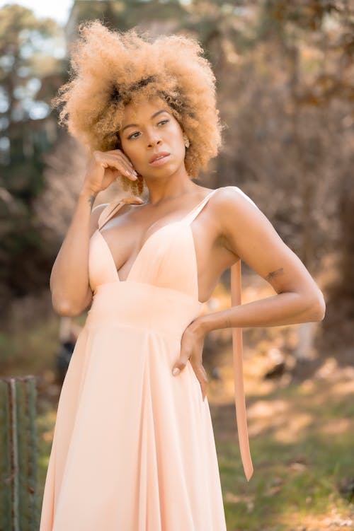 Portrait of Woman in Dress and with Dyed, Blonde Hair