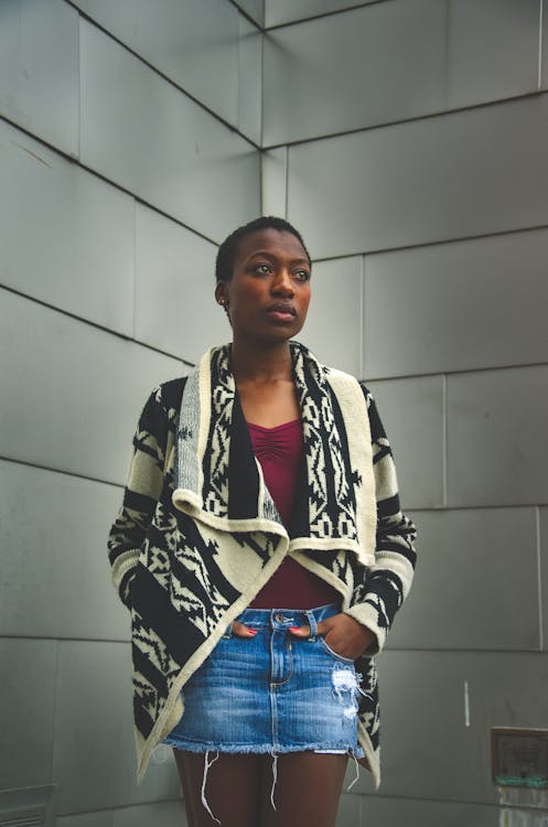 Woman Standing With Both Hands In Pocket