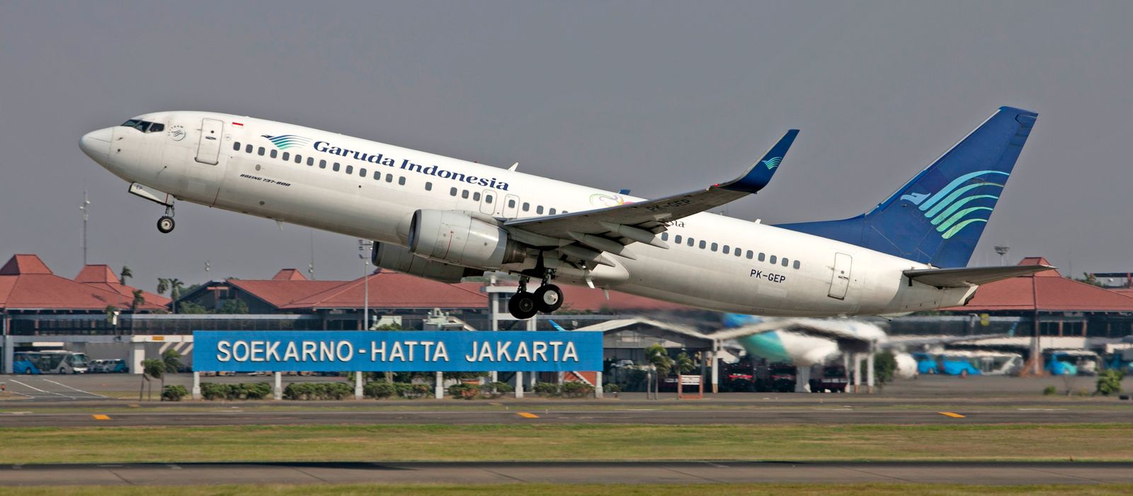 Garuda Indonesia Boeing 737 taking off from Soekarno-Hatta International Airport in Jakarta.