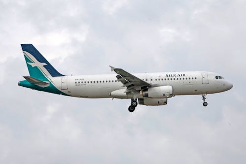 View of a Flying SilkAir Commercial Airplane 