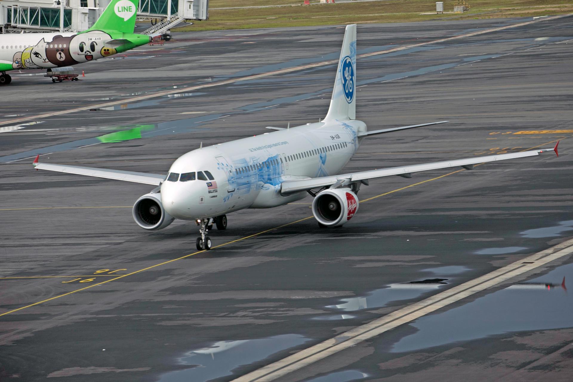 Airliner Airbus A320 in General Electric Livery Taxiing to the Runway