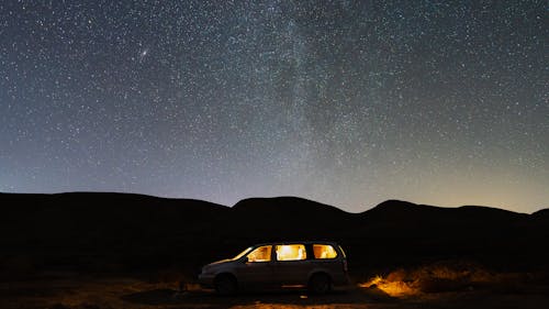 Stars on Night Sky over Car
