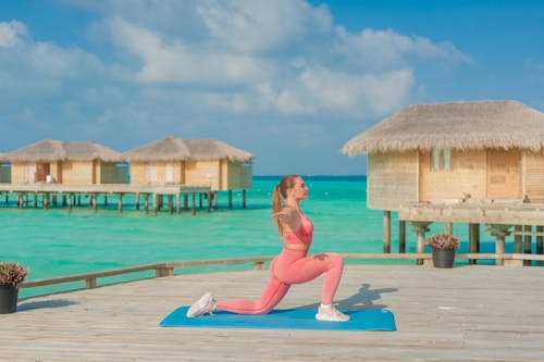 Woman Exercising Yoga on Tropical Sea Shore