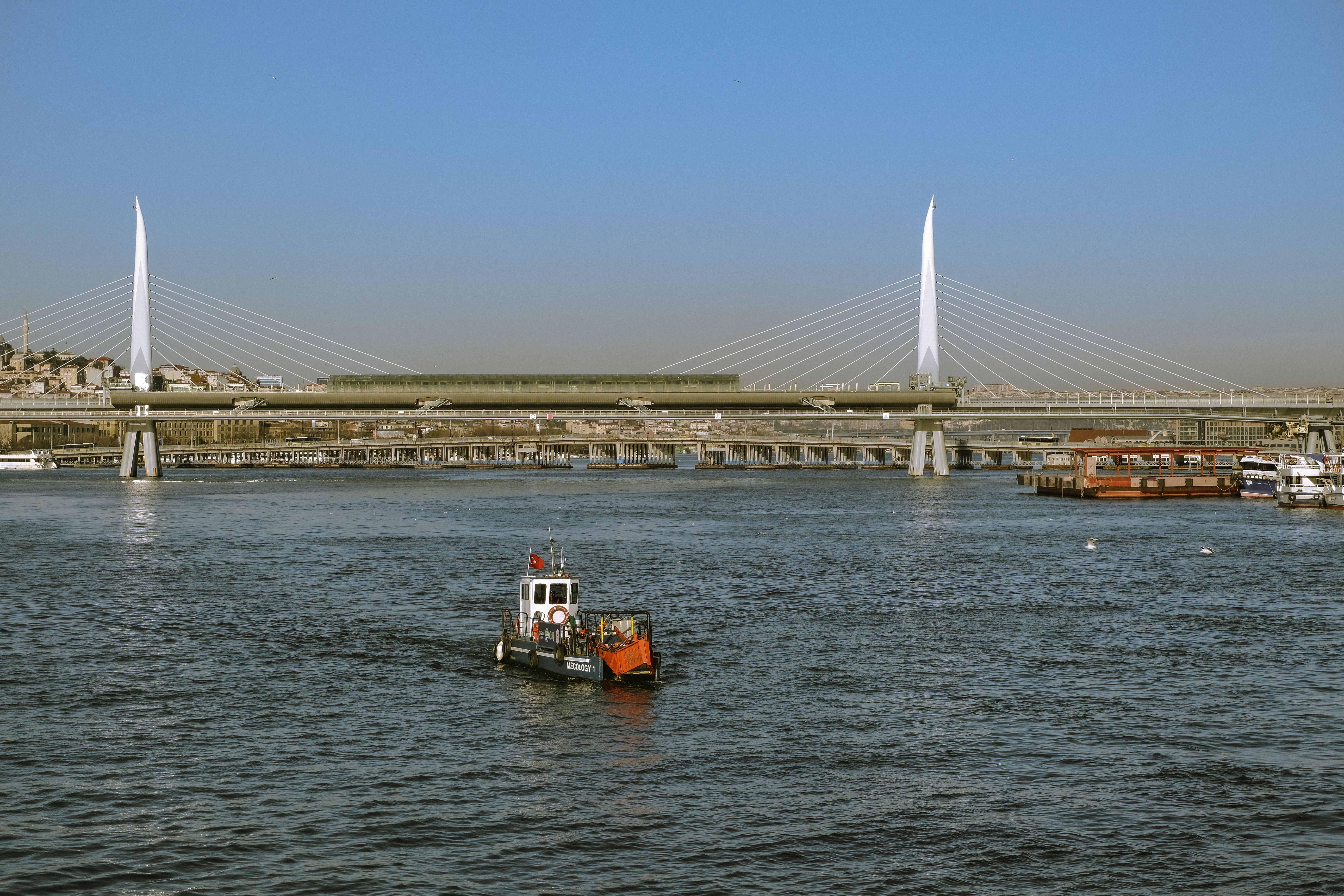 Motorboat on Sea in Istanbul with Halic Bridge behind · Free Stock Photo