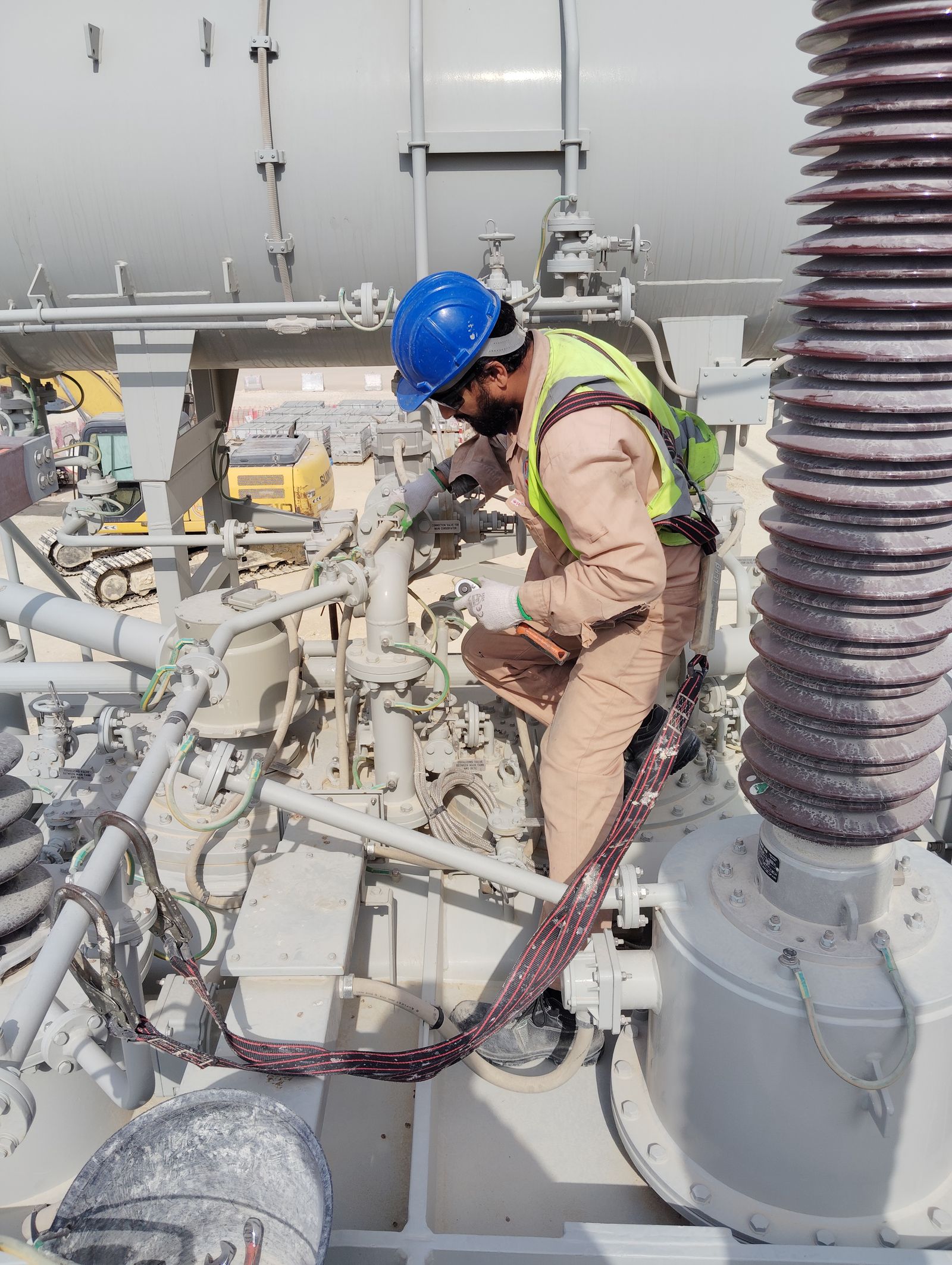 Engineer inspecting industrial mechanical equipment