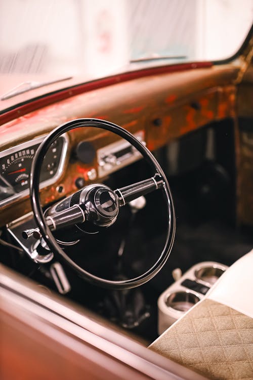 View of the Steering Wheel and Dashboard in a Vintage Car 