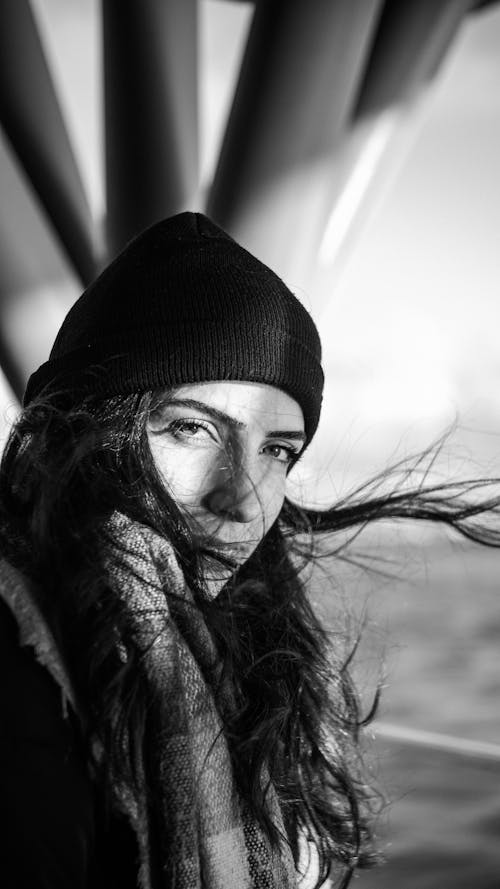 Woman in a Hat and Scarf with Flowing Hair