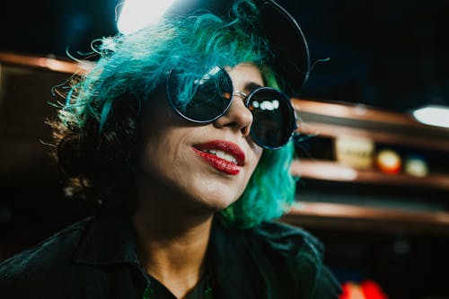 Woman in Cap, Sunglasses and with Blue Hair